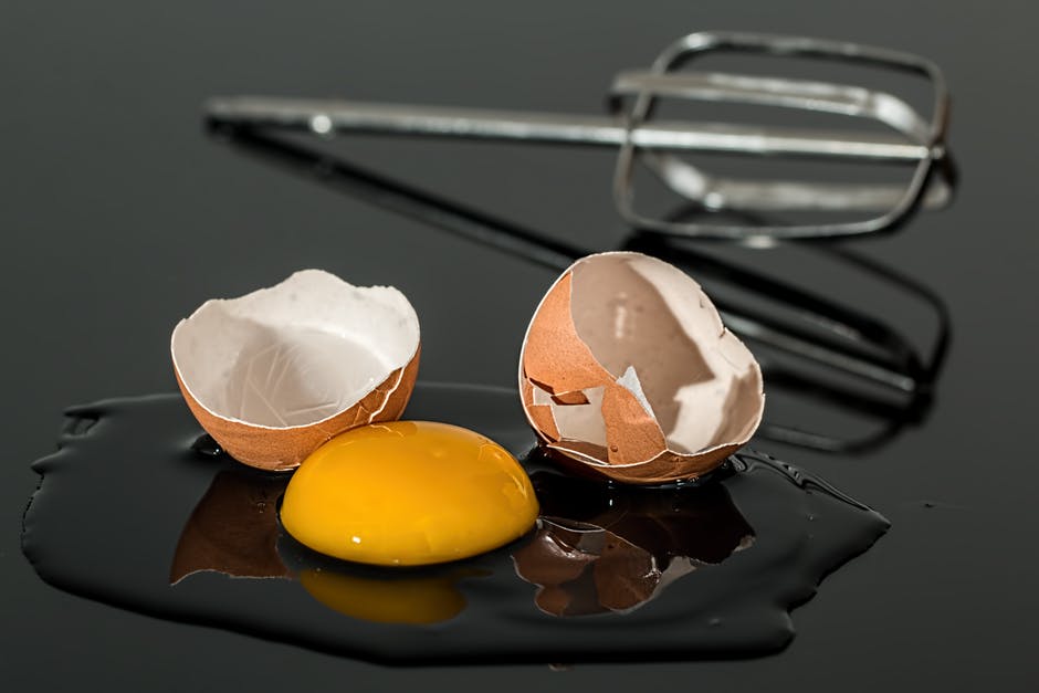cracked open egg yolk