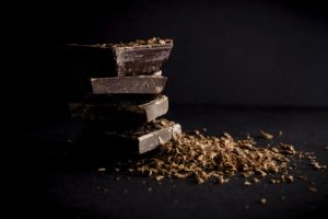 chunks of dark chocolate blocks with shaved pieces
