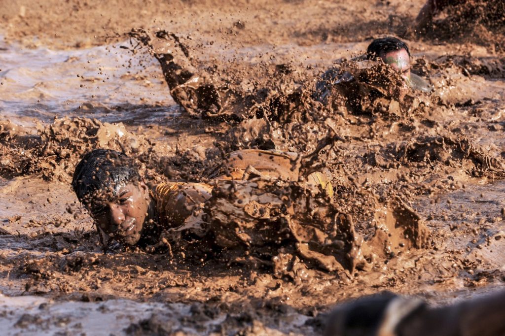 soldiers navigating through the mud