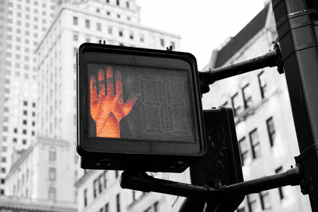 red hand stop sign