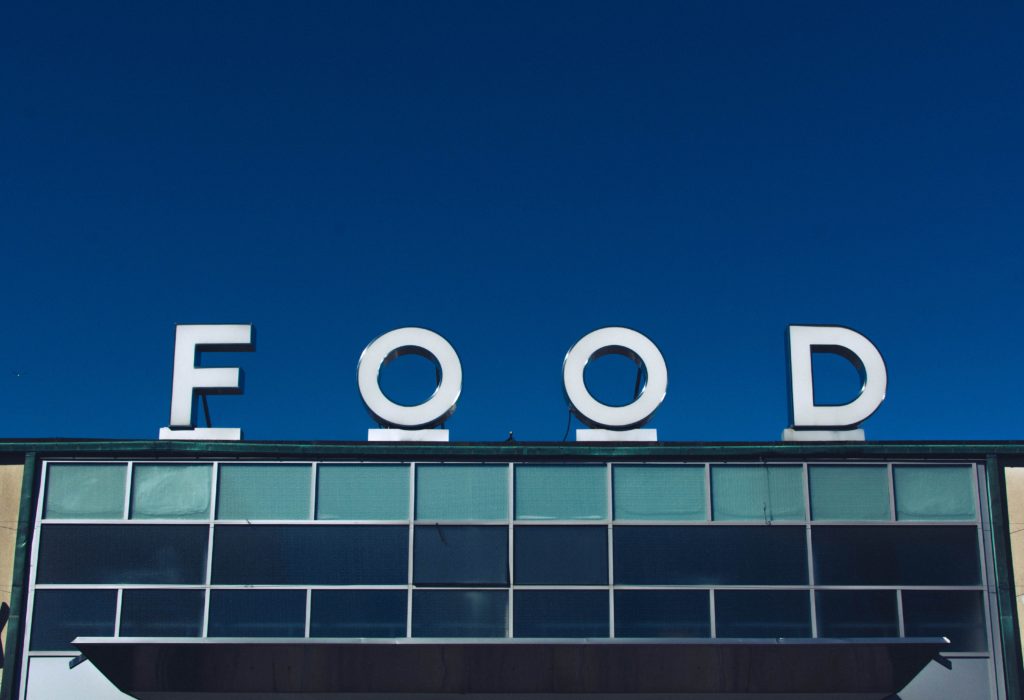 FOOD sign on top of a building