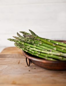 asparagus in a bowl on a table