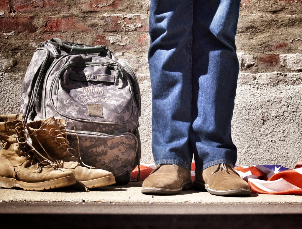 army person with backpack and boots