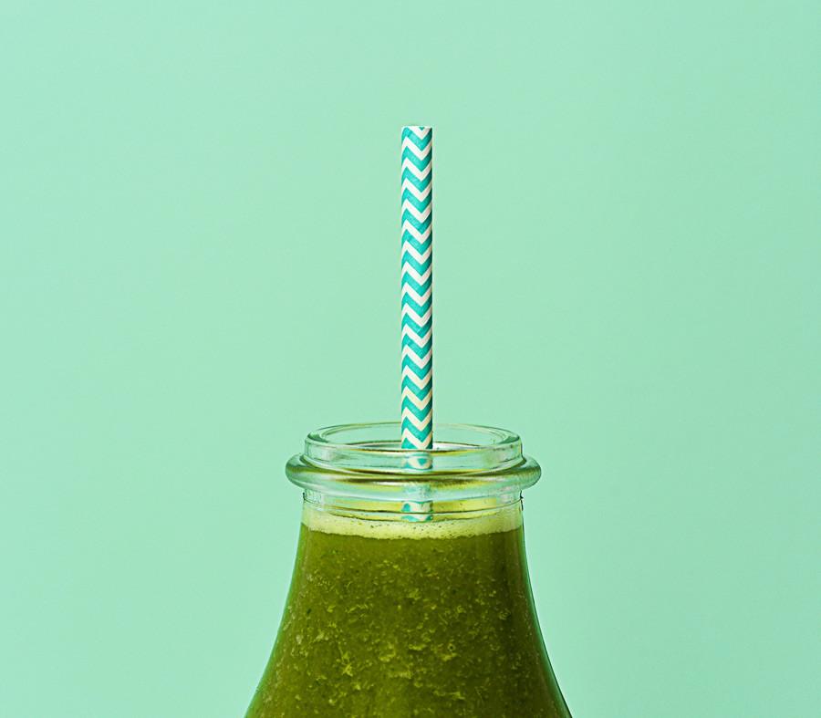 SPRUCE in a bottle with a straw
