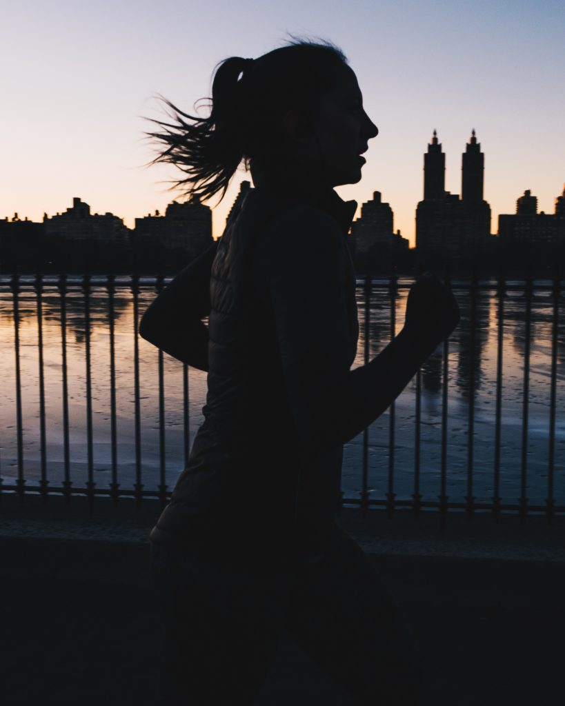 running in the city at sunrise