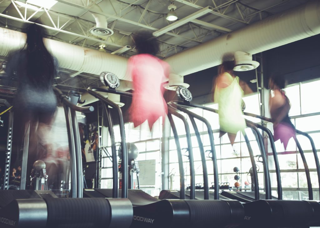 people blurry on treadmills