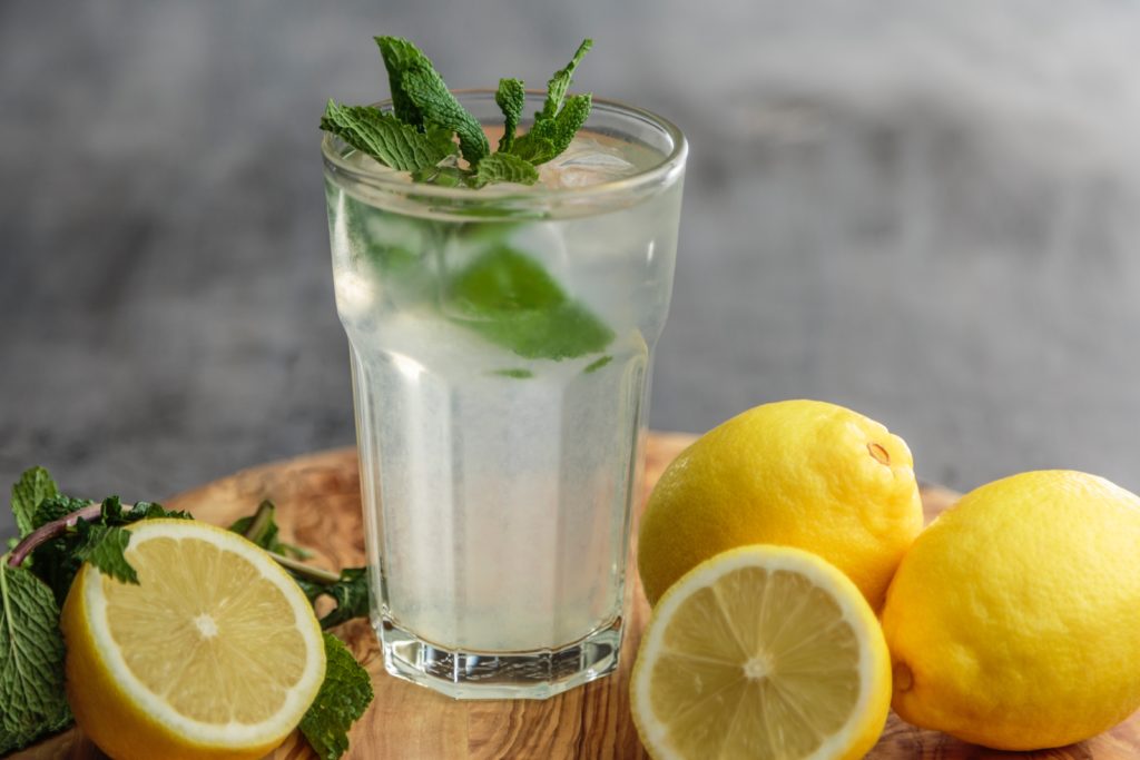 water in a glass with lemon and mint