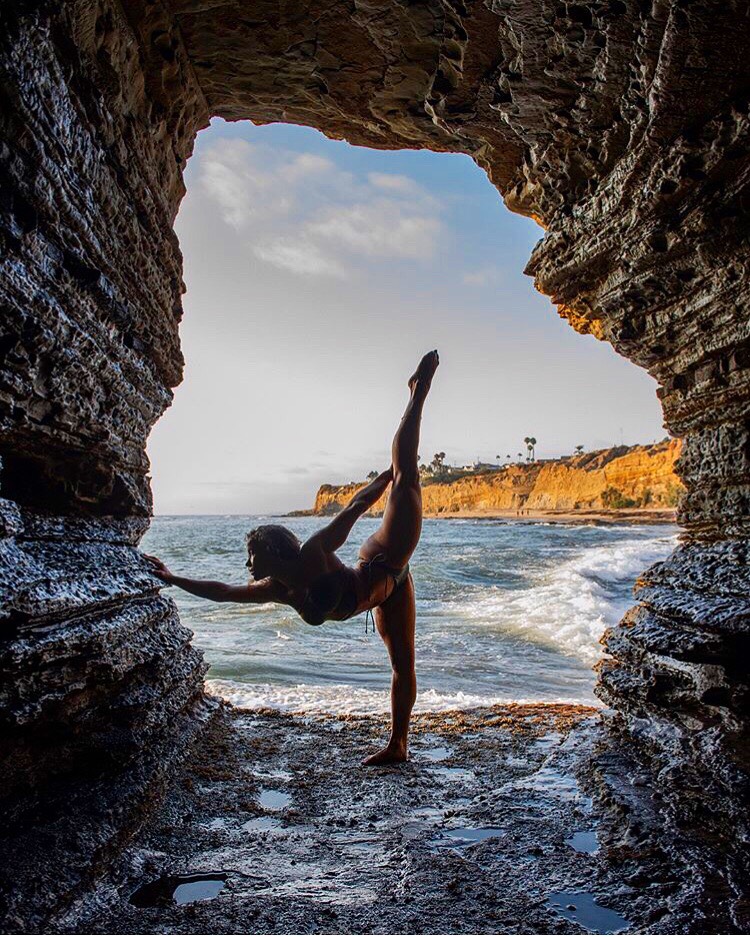 Tatiana Koval doing the air splits between rocks