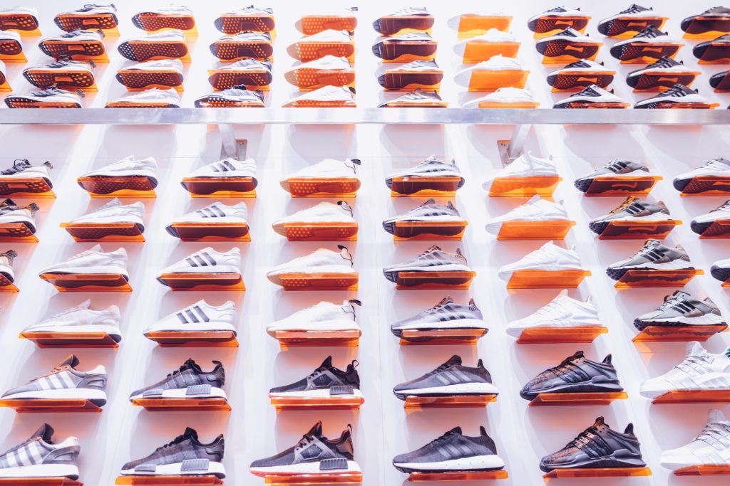 a wall of adidas shoes