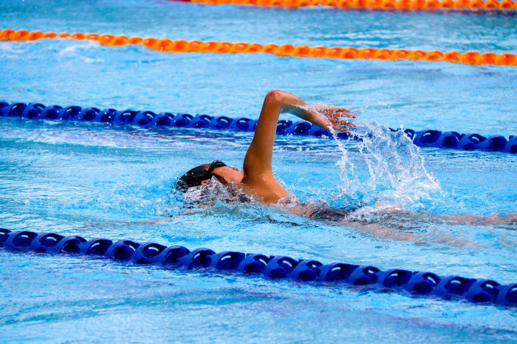 female swimming in a pool