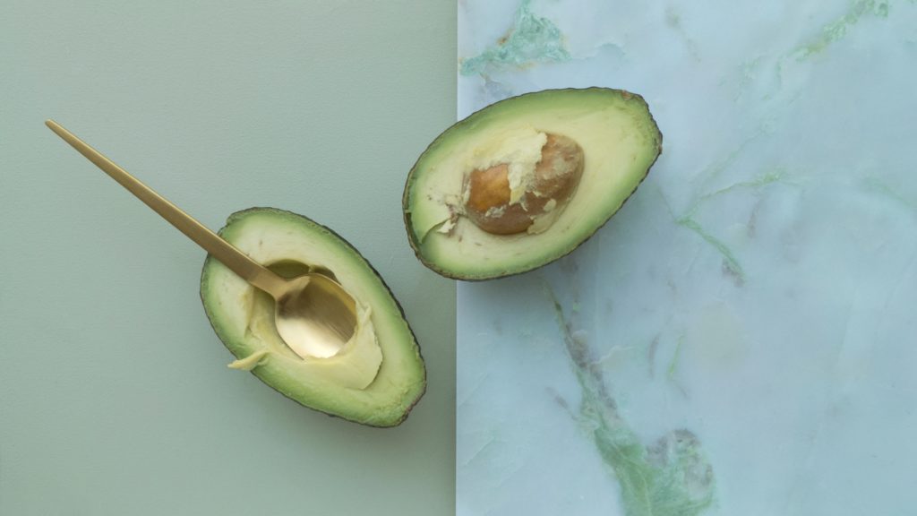 avocado cut in half, spooned out