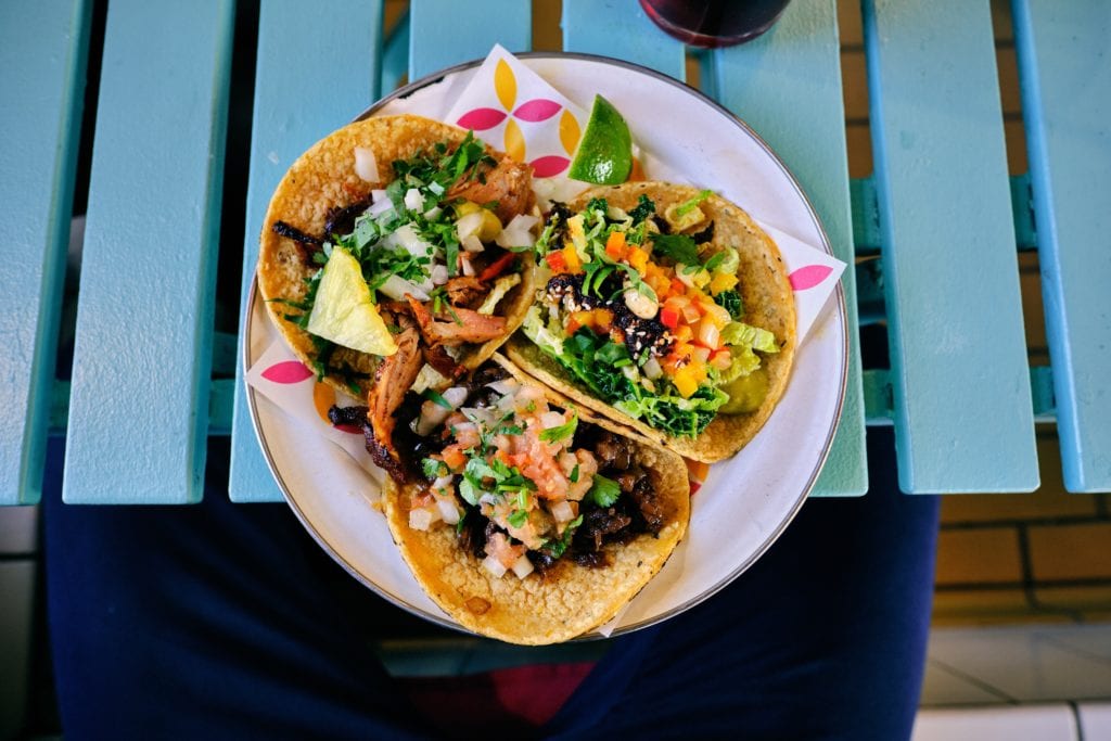 three corn tacos on a plate