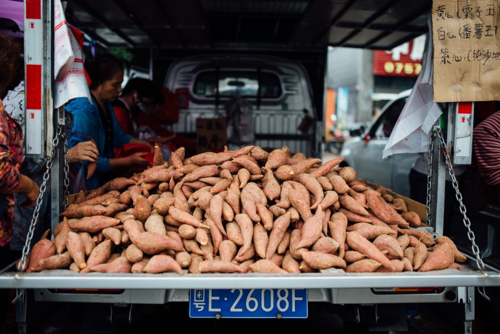 ton of yams in the back of a truck